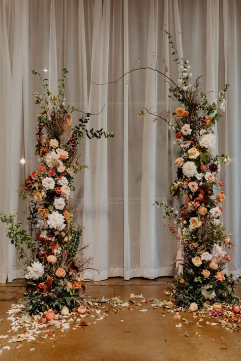 Autumn Wedding Arch Ceremony Backdrop, Fall Wedding Stage Decor, Autumnal Wedding Arch, Autumn Wedding Flower Arch, Fall Wedding Arches Indoor, Ground Ceremony Flowers, Moody Wildflower Wedding, Autumn Wedding Florals, Autumn Wedding Backdrop