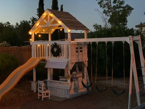 Farmhouse Playhouse Makeover – The Cottage Cutie Swingset Play Area, Wood Playset Plans, Wood Playground Makeover, Outdoor Backyard Playground, Sandbox And Playhouse, Backyard Playground Makeover, Playset Lighting Ideas, Cute Playground Ideas, Playhouse Garden Ideas