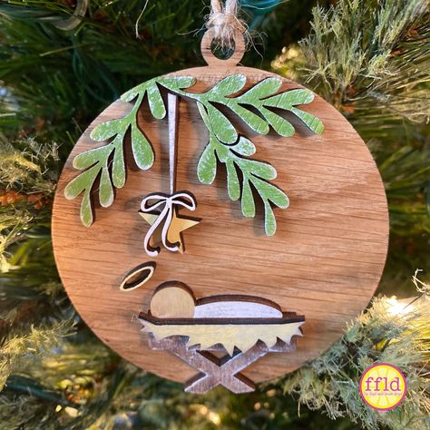 This simple, sweet, beautiful manger scene ornament is a perfect reminder of the true meaning of Christmas.  This ornament is ready to hang and is made of white oak and birch woods. It is hand-painted and slightly distressed for a rustic appeal. Wood Burned Nativity, Manger Scene Ornament, Whimsical Ornaments, Christian Wood Ornaments, Cricut Nativity Projects, Wooden Painted Christmas Ornaments, Diy Nativity Ornaments, Painted Wooden Ornaments, Manger Scenes Nativity