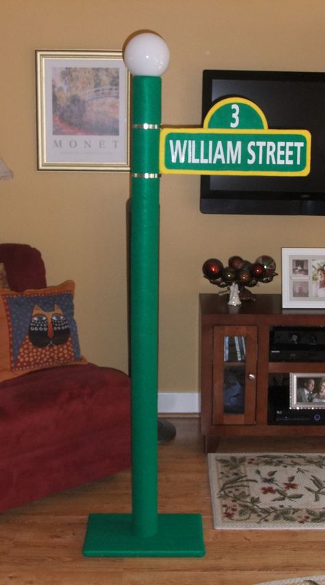 Sesame Street sign & lamp post for William's 3rd birthday Sesame Street Pole Diy, Sesame Street Street Sign, Diy Sesame Street Sign, Sesame Street Sign, Sesame Street Signs, Street Lamp Post, Alice In Wonderland Props, First Birthday Winter, Monster Ideas