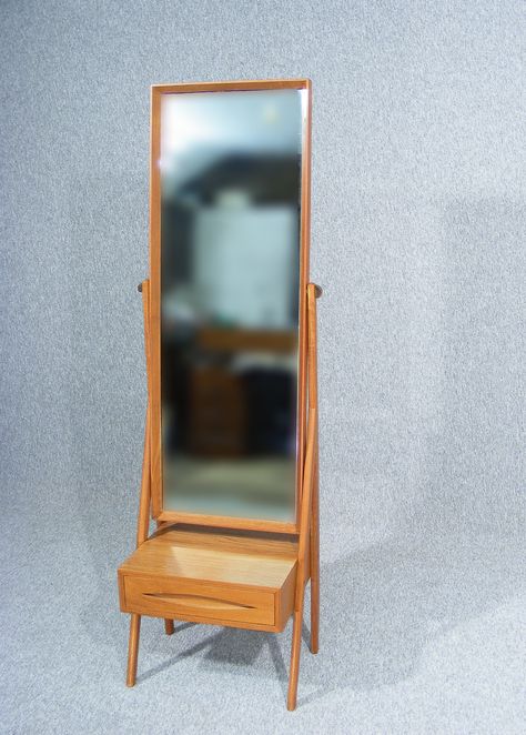 A stylish vintage retro Danish teak full length floor standing cheval mirror designed by Arne Vodder Solid teak easel design frame Lovely clean simple lines Single dove tailed drawer storage below with Vodder's trademark oval drawer pull Mirror can be easily angled via brass fixings on either side Wonderful grain and colour to the teak Stamped "Made in Denmark" on underside  www.antiques-online.org Long Standing Mirror, Vintage Standing Mirror, Mirror Unit, Male Aesthetic, Home Interior Accessories, Long Mirror, Arne Vodder, Cheval Mirror, Mirror Ideas