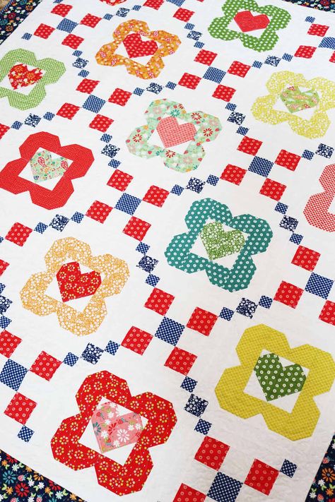 I Heart Flowers Layer Cake Quilt - A Quilting Life Flowers Quilt Pattern, Valentine Quilts, 10 Layer Cake, Layer Cake Quilt, Bright Cross Stitch, A Quilting Life, Layer Cake Quilt Patterns, Flower Quilt Patterns, Quilting 101