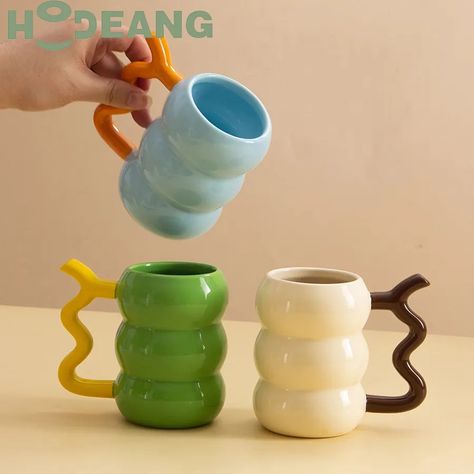 280ml Creative contrasting color ceramic coffee mug with creative handle Mugs With Cool Handles, Cool Ceramic Mug Handles, Mug With Unique Handle, Interesting Mug Handles, Pottery Mug Handles Unique, Ceramics Pottery Bowls, Thermos Flask, Letter Mugs, Thermos Bottle