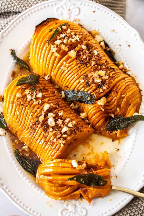 Hasselback butternut squash, with it’s maple-balsamic glaze is easy to make but very impressive. The post Hasselback Butternut Squash appeared first on Sugar Salt Magic. Hasselback Butternut Squash, Cheesy Potato Bake, Butternut Soup, Maple Balsamic, Fall Fun Food, Butternut Squash Recipes, Holiday Side Dishes, Holiday Meal, Sage Leaves