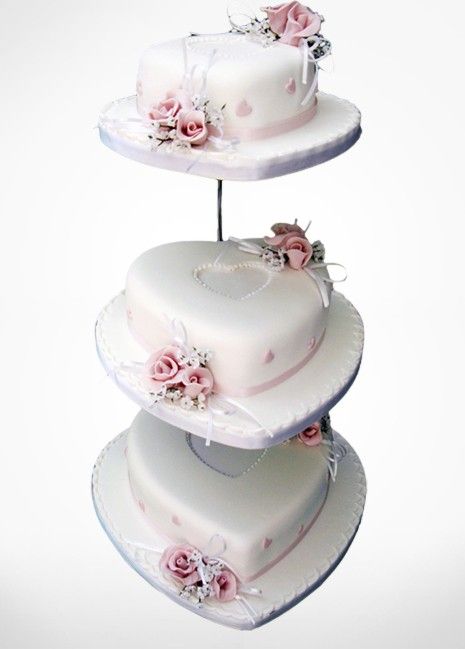 THREE TIER HEART SHAPE WEDDING CAKE.  THIS DARLING WEDDING CAKE WITH ITS CENTRE HEARTS AND BEAUTIFUL SUBTLE FLOWERS WILL BE STUNNING AT ANY STYLE WEDDING. Heart Wedding Cake, Hanging Cake, Learn Cake Decorating, How To Make Wedding Cake, Wedding Shower Cakes, Wedding Cake Images, Heart Wedding Cakes, Wedding Cake Display, Mini Wedding Cakes