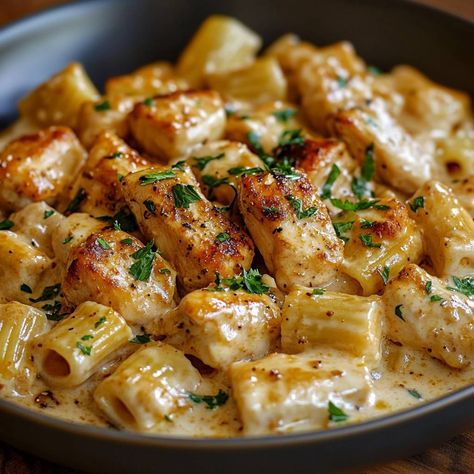 Creamy Parmesan Chicken with Rigatoni Pasta is a simple and tasty dish that everyone will love. It’s quick to prepare and has creamy, cheesy goodness in every bite. This meal is perfect for busy weeknights or any family gathering. Why Make This Recipe This recipe is easy to make and packed with flavor. The combination Family Dinner Recipes Casserole, Easy Apartment Recipes, Meals With Rigatoni Noodles, Dinner To Feed A Large Family, Recipes To Impress Girlfriend, Main Course Dinner Ideas, Simple Two Person Dinners, Pasta Dinners With Chicken, Chicken Rigatoni Recipes Baked