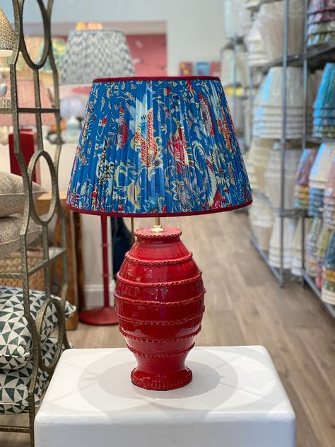 Handmade block print lampshade designed in house with contrasting red grosgrain trim Dimensions are listed as follows: Top Diameter x Bottom Diameter x Side Length Availability: In-stock items ship same or next business day For those who prefer a more personal shopping experience, local pickup is available at 2415 Ivy Funky Lampshades, Print Lampshade, Blue Block Print, Floral Lamp, Lampshade Designs, Paper Lampshade, Charlottesville Virginia, Cordless Lamps, Mini Lamp