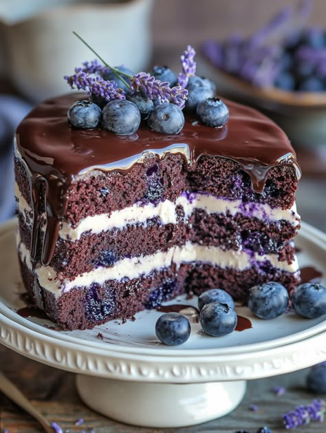 Blueberry Chocolate Lavender Cake 🫐  🫐 Ingredients 🫐  1 1/2 cups all-purpose flour 1 1/2 teaspoons baking powder 1/2 teaspoon baking soda 1/4 teaspoon salt 1/2 cup unsalted butter, softened 1 cup granulated sugar 2 large eggs 1 teaspoon vanilla extract 1/2 cup sour cream 1/2 cup whole milk 1/2 cup cocoa powder 1 cup fresh blueberries 1 tablespoon dried culinary lavender 1/2 cup blueberry jam 2 cups cream cheese frosting Fresh blueberries and lavender sprigs for garnish Chocolate ganache Blueberry Lavender, Blueberry Chocolate Cake, Blueberry Chocolate, Decadent Food, Culinary Lavender, Bakers Gonna Bake, Cooking Show, Cake Ingredients, Desert Recipes