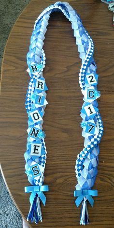 Ribbon lei for my sis in law's high school graduation Graduation Candy Lei, Grad Leis, Graduation Leis Diy Ribbons, Money Lei Diy, Graduation Leis Diy, Graduation Money Lei, Candy Lei, Diy Graduation Gifts, College Graduation Cap Decoration