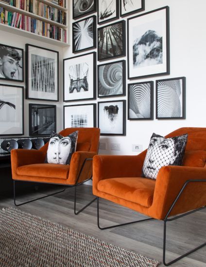 Ever wondered what single colour would liven up the entire downstairs of your home unlike no other? An orange living room is the secret ingredient for bringing a surge of confidence & dynamism to your decor.   Orange Vintage - Fashion, Home, Cars, Interiors and Nostalgia For Kate Beavis #orangevintagefashion #orangevintagehome #orangevintageinteriors #orangevintagenostalgia #orangevintagecars #orangevintagelifestyle #orangevintagelife #orangevintage White Walls Grey Furniture Living Room, Orange Black And White Bedroom, Office With Orange Accents, Orange And Black Interior, Burnt Orange Armchair, Black White Orange Living Room, Black And Orange Decor, Orange Armchair Living Room, Show Home Living Room