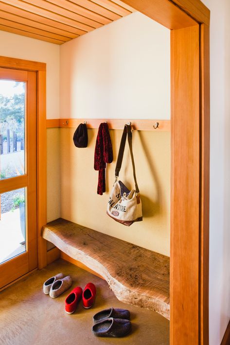 A live edge bench, harvested from the site, balances the carved door of the bathroom on the opposite end of the entry/mudroom. Bench Coat Rack, Foyer Wallpaper, Coat Rack Bench, Diy Entryway Bench, Entry Mudroom, Diy Entryway, Live Edge Furniture, Bench Ideas, Bench Decor