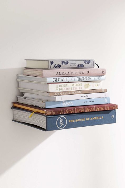 Zero in on the reads of the moment with this floating book shelf that’s super sturdy. | 25 Amazingly Clever Ways To Display Books In Your Home Invisible Bookshelf, Modern Bohemian Bedroom, Floating Bookshelf, Floating Bookshelves, Regal Design, Modern Shelf, Wall Bookshelves, Book Wall, Wood Wall Shelf