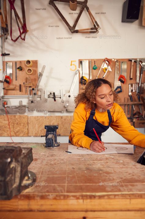 Female Craftsperson In Carpentry Workshop For Bamboo Bicycles Using Digital Tablet by monkeybusiness. Female Craftsperson In Carpentry Workshop For Bamboo Bicycles Using Digital Tablet #AD #Carpentry, #Workshop, #Female, #Craftsperson Woodworker Aesthetic, Carpentry Aesthetic, Female Woodworker, Woodworking Aesthetic, Women In Construction, Carpenter Aesthetic, Bamboo Bicycle, Cinematic Composition, Skilled Trades