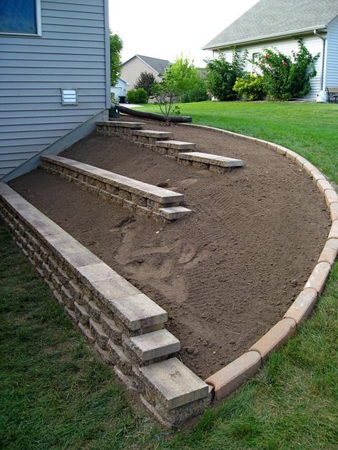 Retaining wall all done | and ready for some planting | Flickr Small Hill Retaining Wall, Garden With Retaining Wall, Retaining Wall Steps Sloped Backyard, Allen Block Retaining Wall, Simple Retaining Wall Ideas, Sloped Landscape Ideas, Retaining Wall Flower Bed Ideas, Concrete Retaining Wall Ideas, Cheap Retaining Wall Ideas