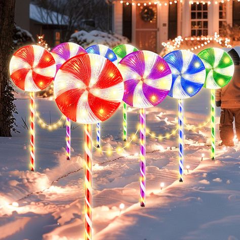 PRICES MAY VARY. 【Large 28 Inch Outdoor Christmas Lollipop Light with Light Strip】: This is a upgraded Christmas light featuring large lollipop shapes above the candy canes. Each light is connected by light strips in between, each interval has 10 LED, each lollipop light has 20 LED, super bright, add a romantic and cozy touch to your holiday display. 【230 Super Bright LED】: Featuring with 230 bright warm white LED lights, 14 LED of each lollipop topper, 6 LED of each post, 10 LED of each light s Candyland Christmas Decorations Outdoor, Christmas Lollipop Decorations, Christmas Pathway Lights, Snowflake Christmas Lights, Xmas Decorations Outdoor, Candy Decorations Diy, Christmas Candy Cane Decorations, Christmas Lights Outside, Snowflake Lights