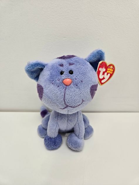 TY Beanie Baby Periwinkle the Cat from Blue's Clues is a very rare and hard Beanie to find! Periwinkle is in mint condition and comes with a tag protector on. Thanks for visiting my shop! ✨Vintage 1990s and 2000s Beanie Babies were kept on display or carefully stored throughout the years.  ✨They are in new condition with mint tags unless otherwise disclosed in the listing. ✨Shipping time is 1 business day. ✨All Beanies include a tag protector! ✨Happy to answer questions! Feel free to send me a m Baby Beenies, Cat Beanie Baby, Ty Bears, Garfield And Odie, Blue's Clues, Cat Items, Blues Clues, Raising Chickens, Beanie Babies