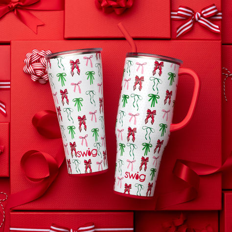 Bigger is better! 😍 Living in your hair-bow era? Festive red and green bows with ivory pearls are the definition of coquette girlycore and Christmas elegance.

Enjoy fewer refills and more time on the move with our biggest bundle ever! Our 40oz Mega Mug and 32oz Tumbler are both comfortable to hold and cup holder friendly, making them the perfect pair for life on the go! Christmas Definition, Mega Mug, Palmetto Moon, Lake Girl, Backpack Lunch Bag, 9 Hours, Green Bows, Ivory Pearl, Cooler Bag