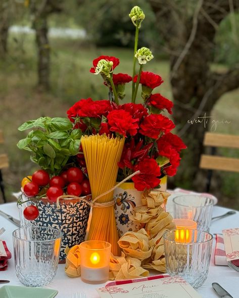 Channeling ultimate Italian vibes with this gorgeous table setup! 🍅🌿 Red carnations paired with fresh basil, tomatoes, chili peppers, and pasta make for a deliciously rustic centerpiece. Perfect for any Italian-inspired dinner party! 🇮🇹✨ #ItalianDining #TableDecor #FoodInspiration #DinnerParty #RusticElegance #eventigaia #weddingplanner #destinationwedding Italian Themed Parties Decorations, Italian Party Centerpieces, Italian Dinner Table Decor, Italian Tablescape Ideas, Italian Table Setting Dinner Parties, Tomato Dinner Party, Italian Centerpieces Table Decorations, Italian Theme Bridal Shower Ideas, Thats Amore Engagement Party