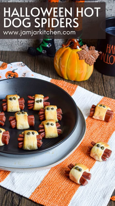 Halloween snack appetizer hot dog crescent roll spiders Spiders In A Blanket, Halloween Savory Snacks For Party, Easy Halloween Snacks Savory, Spider Dogs In Oven, Halloween Gathering Food, Spider Pigs In A Blanket, Halloween Bites Ideas, Spooky Pigs In A Blanket, Appiterzers Easy Recipes Halloween