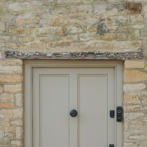 From The Anvil on Instagram: "On the front door of Bee's traditional thatched cottage, you’ll find our Aged Bronze lever lock set, matching letter plate & cover as well as our Beehive centre door knob 💫  The rich appearance of our Aged Bronze finish is a wonderful match for this taupe paint colour.   To discover our full range of Aged Bronze front door furniture, head to our website. . . . . #fromtheanvil #ironmongery #frontdoor #agedbronze #thatchedcottage #cottagecore #cottagestyle #cotswoldstone #cotswoldcottage" Taupe Front Door Colors, Beige Front Door, Bronze Front Door, Fromt Doors, Cottage Front Door, Front Door Furniture, Taupe Paint Colors, Cottage Front Doors, Cotswold Cottage