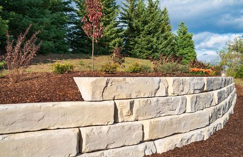 Large Limestone Rock Landscape, Large Block Retaining Wall, Large Stone Retaining Wall, Limestone Retaining Wall Ideas, Retaining Wall Front Of House, Wall Ledge Ideas, Large Retaining Wall Blocks, Large Retaining Wall, Limestone Retaining Wall