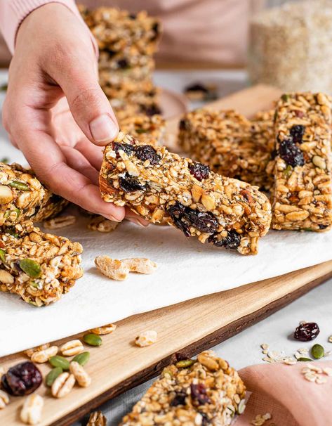 Puffed Rice Granola Bars! STICKY & SOFT but hold together well with a bit of CRUNCH! Peanut Buttery, Festive, and Ready In Minutes! *I often make this with decreased amounts of maple syrup & pb. The bars will be more crumbly but make a tasty looser granola that saves a bit of 💰! #tastythriftytimely #veganfood #veganrecipes #plantbasedfood #vegansnacks #veganrecipesforkids #vegangranolabars #ricepuff Puffed Rice Granola, Almonds Roasted, Vegan Granola Bars, Chocolate Granola Bars, Puffed Rice Cereal, Rice Recipes Vegan, Vegan Kids Recipes, Easy Pumpkin Pie, Homemade Granola Bars