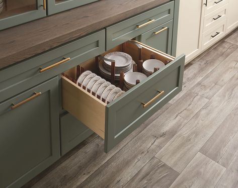 Create custom drawer storage in the kitchen with Hӓfele's Fineline Drawer Organization System. The base plate and peg board system pictured here allows you to create custom storage for plates, bowls and other dishes as needed. The walnut finish adds a touch of elegance to any kitchen design. #luxurykitchen #modernkitchen #highendkitchen #kitchendesign #customkitchen Plate Drawer In Kitchen, Kitchen Drawers For Plates, Dish Drawer With Pegs, Kitchen Drawers For Plates And Bowls, Dinner Plate Drawer, Peg System Kitchen Drawer, Kitchen Pans, Cabinetry Hardware, Drawer Inserts