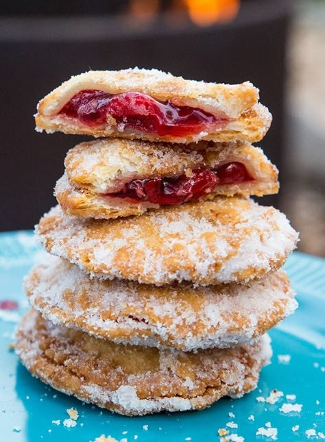 Campfire Cherry Hand Pies....do I have you intrigued? These little delights were made while camping, they are THAT easy! Campfire Pies, Pie Iron Recipes, Cherry Hand Pies, Campfire Desserts, Pie Iron, Camping Menu, Camping Desserts, Camping Snacks, Camping Dinners