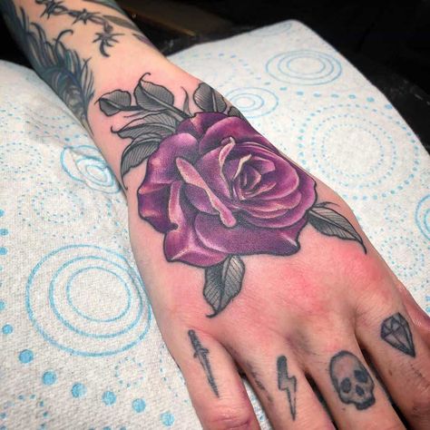 Purple Flower Tattoo, Rose Tattoo On Hand, Purple Rose Tattoo, Purple Flower Tattoos, Purple Rose Tattoos, Rose Tattoo Meaning, Purple Tattoos, Bolt Tattoo, Rose Hand Tattoo