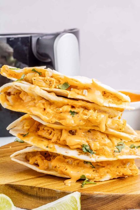 Craving something delicious and easy? Try these Air Fryer Buffalo Chicken Quesadillas! They're quick to make and packed with flavor, with shredded chicken, tangy buffalo sauce, and creamy ranch dressing all wrapped up in a tortilla and air-fried to perfection. Air Fryer Chicken Tortilla Wraps, Buffalo Chicken Pita Pocket, Chicken Pita Pockets, Chicken Tortilla Wraps, Buffalo Chicken Pinwheels, Chicken Fajita Wraps, Air Fryer Buffalo Chicken, Buffalo Chicken Fries, Buffalo Chicken Quesadilla