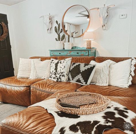 Cow Inspired Living Room, Boho Western Couch Pillows, Cowhide Pillows Living Rooms, Apartment Living Room Leather Couch, Cow Canvas Decor, Western Couch Pillows, Couch Pillow Inspiration, Aztec Living Room Ideas, Vintage Boho House Decor