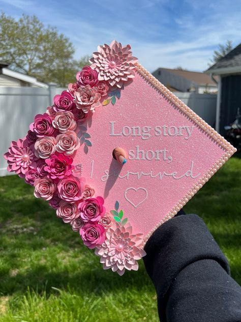 Personalized graduation cap topper, pink shades, silver, pearls, quote "Long story short, I survived". Let your personality shine✨ Grad Cap Inspo Funny, Cute Girly Graduation Cap, Lpn Cap Decoration Graduation, Grad Topper Ideas, Graduation Cap Mom, White Graduation Cap Designs, Unique Graduation Cap Designs College, Red Graduation Cap Designs, Graduation Cap Designs Cute