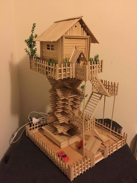 Popsicle Stick Tree House, Tree House Miniature, House From Ice Cream Stick, Ice Cream Stick House Craft, Stick Ice Cream Craft, Ice Sticks Craft Ideas, Ice Cream Stick Art, Ice Cream Stick House, Kandang Hamster