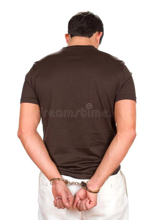 Handcuffed Criminal. Arrested criminal stands with his hands handcuffed behind h #Sponsored , #SPONSORED, #Paid, #Criminal, #hands, #handcuffed, #Arrested Handcuffed Pose, Hands Behind Back Pose, Man Standing, His Hands, Stock Images, Stock Photos, Mens Tshirts, Mens Tops