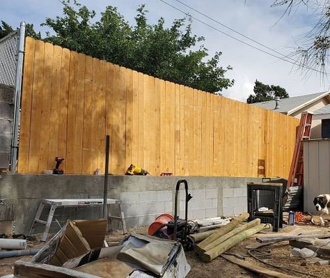 Concrete Block Fence Ideas, Wood Fence On Top Of Cinder Block Wall, Cinder Block Privacy Fence, Backyard Block Wall Ideas, Cinder Block Privacy Wall, Cinder Block Wall Covering Ideas, Cinderblock Fence Ideas, Cement Block Fence, Cinder Block Fence With Wood