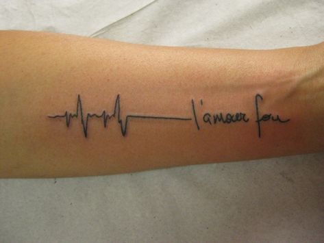 At the end of the line is a message in French, with the first word speaking of love. I couldn't make out the second word. If someone can identify it, leave it in the comments section. Micael Faccio via Flickr Almost all of us have seen someone we... Flatline Tattoo, Tatuaje Ekg, Ekg Tattoo, Sexiest Tattoos, Classy Tattoos For Women, 22 Tattoo, Scripture Tattoos, Places To Get Tattoos, Flower Wrist Tattoos