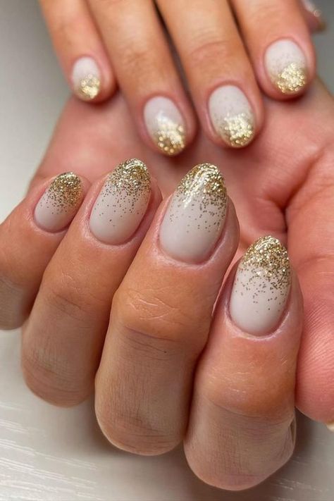 White And Gold Nails Ombre, Gold Holiday Nails Glitter, White With Gold Sparkle Nails, White Nails With Gold Glitter Tips, Gold And Milky White Nails, White Nails With Gold Sparkles, French Manicure With Gold Glitter, Gold Glitter Manicure, White With Gold Glitter Nails