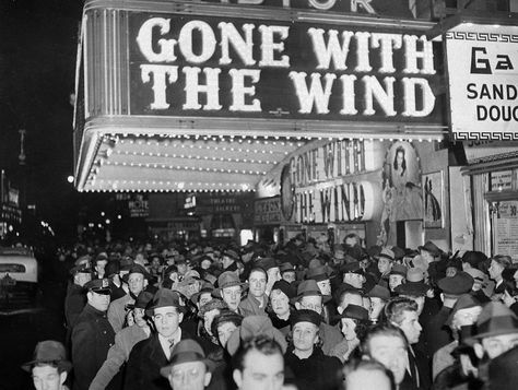 A crowd gathers under the "Gone With the Wind" marquee outside the Astor Theater on Broadway during the movie's premiere in New York City on Dec. 19, 1939. The movie also opened at the Capitol Theater a few blocks north. (AP Photo). Margaret Mitchell, Tomorrow Is Another Day, Go To Movies, Gone With The Wind, Opening Night, Ryan Gosling, Movie Theater, Great Movies, Film Movie