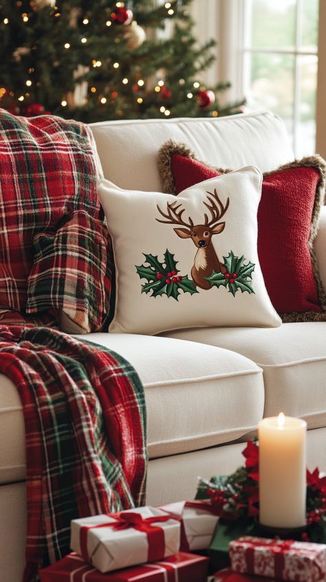 Cozy Christmas living room with a white sofa, red and green decor, plaid blanket, festive pillow, lit candle, and wrapped gifts. Christmas Pillows Living Room, Christmas Pillows On Sectional Couch, Christmas Sofa Pillows, Red Christmas Decor Living Rooms, Red And Green Christmas Living Room, Christmas Pillows On Couch Ideas, Cozy Christmas Decor Living Room, Sleigh Decorating Ideas Christmas, Christmas Decor Tv Stand