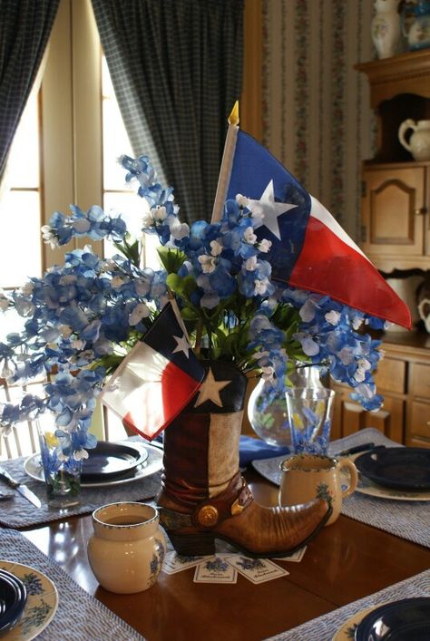 Like the Bluebonnets,and Texas Flags. Would work in Mason jar with fewer flowers Texas Themed Table Centerpieces, Bluebonnet Decor, Texas Party Decorations, Alter Arrangements, Texas Images, Western Centerpieces, Texas Independence Day, Texas Party, Boot Vase