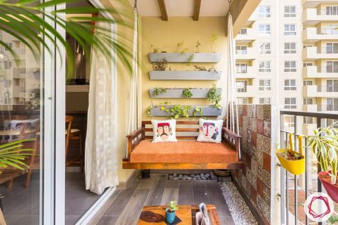 10 Comfortable Balcony Seating Ideas that Let you Lounge in Style Balcony Zula Design, Kitchen Balcony Ideas Indian, Swings For Balcony, Balcony Utility Ideas, Jhoola In Balcony, Utility Balcony Ideas Indian, Zula In Balcony, Flat Balcony Ideas, Balcony Swing Ideas