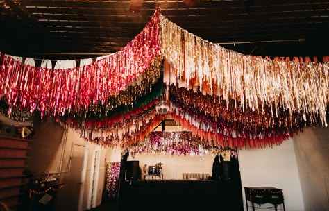 Have you ever wondered what it would be like to get married on Leap Day? Well this whimsical and unique day is perfect inspiration! From the sequin bridal gown and colorful bridesmaids dresses, to the disco balls, confetti and ceiling streamers, it's one big colorful party! Best part? The bride and groom tackled so many wedding DIY projects and pulled them all off! #gws #discowedding #greenweddingshoes #diywedding #whimsicalwedding #funwedding Party Decor Ceiling, Streamer Wedding Decorations, Fringe Wedding Decor, Diy Ceiling Fringe, Ceiling Streamer Decorations, Avant Garde Wedding Decor, Fringe Ceiling Decor, Disco Party Diy, Diy Disco Party Decorations