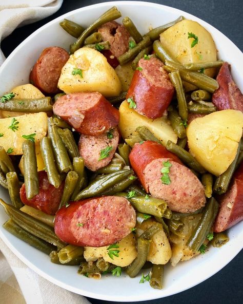 Crockpot sausage, potatoes & green beans is a tasty one-pot recipe that uses simple, affordable ingredients. Also known as Hoosier Stew, this smoked sausage & potato recipe is kid-friendly and family friendly. This is also a recipe that can be served year-round. Instructions to make this easy slow cooker meal in the Instant Pot are also included. Crockpot Sausage Potatoes, Green Beans And Ham, Sausage Potatoes Green Beans, Crockpot Sausage And Potatoes, Smoked Sausage And Potato Recipe, Sausage Crockpot Recipes, Sausage And Green Beans, Potato Recipes Crockpot, Beans And Ham