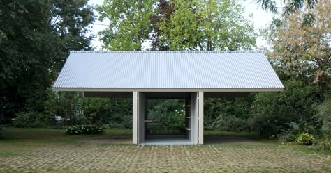 surrounded by trees and other lush vegetation, this small building by studiospazio contains a workshop as well as external space for two parked cars. Small Structures, Garage And Workshop, Temporary Structures, Garden Pavilion, John Pawson, Workshop Garage, Architectural Section, Architectural Practice, Architectural Sketch