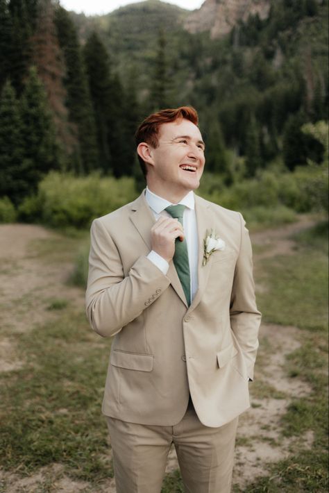 Groom With Tan Suit, Beige Suit With Sage Green Tie, Groomsmen Attire Green Tie, Tan Suit With Sage Green Tie, Sage And Tan Groomsmen, Tan Suit With Green Tie, Tan Suit With Green Bow Tie, Groomsmen Tan Suit Green Tie, Green Groom Tan Groomsmen