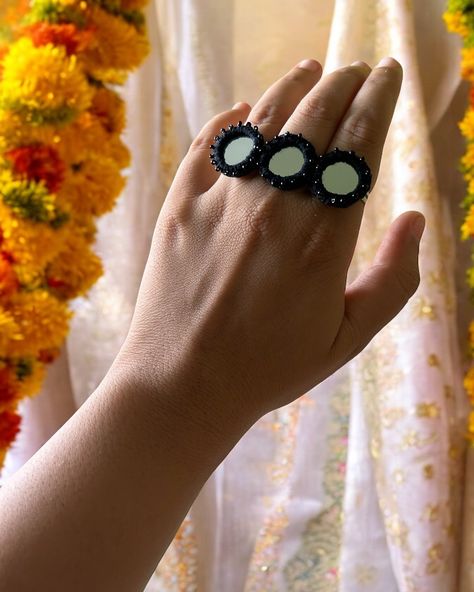 Black Mirror beaded Handmade Ring. Follow @jewelwati for more. •Free shipping on every prepaid order. •COD Available •Easy returns/exchange •To place order click the website link in bio 💻 •You can also DM us / WhatsApp on 9330793275 to order. . . . #rings #handmadering #bohemianjewelry #bohostyle #bohojewelry #handmadejewelry #mirrorjewellery . . . ( handmade jewellery, handmade ring, boho style, boho jewellery, boho vibes, women rings, explore page, beaded rings, mirror jewellery ) Mirror Work Jewellery Handmade, Navratri Art, Navratri Jewellery, Mirror Jewellery, Kutchi Work, Navratri Dress, Diy Fabric Jewellery, Fabric Jewellery, Handmade Boho Jewelry