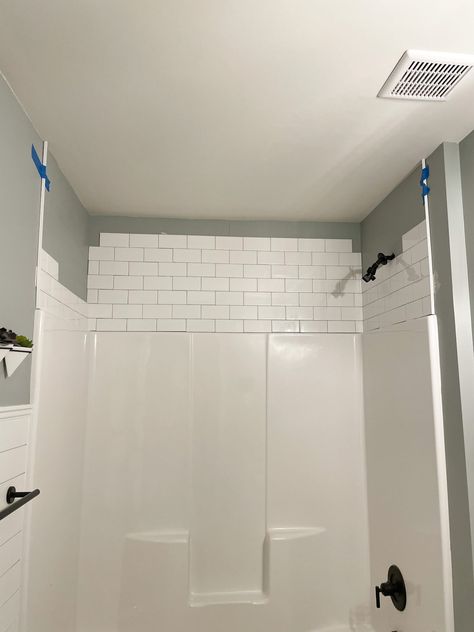 DIY MODERN FARMHOUSE BATHROOM WITH TILE WALL & DARK GROUT | A Classy Fashionista Tiling Above Shower Surround, Shiplap Over Tile Bathroom, Tile Above Shower Surround Ideas, Tile On Bathroom Wall Ideas, Tile With Dark Grout Bathroom, Subway Tile With Dark Grout Bathroom, Above Shower Surround Ideas, Shiplap And Tile Bathroom, Tile Trim In Bathroom