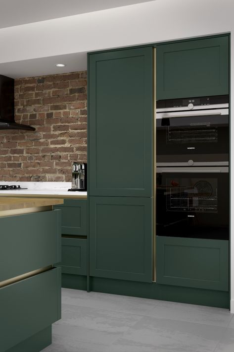 A simple shaker design with an ultra-modern twist, Clifden takes flair and panache to the next level through a bold colour choice, industrial styling and a rich brass handleless trim. Green Shaker Kitchen, Modern Shaker Kitchen, Shaker Kitchen Design, Dark Green Kitchen, Shaker Design, Handleless Kitchen, Shaker Kitchen Cabinets, Shaker Style Kitchens, Dark Kitchen Cabinets