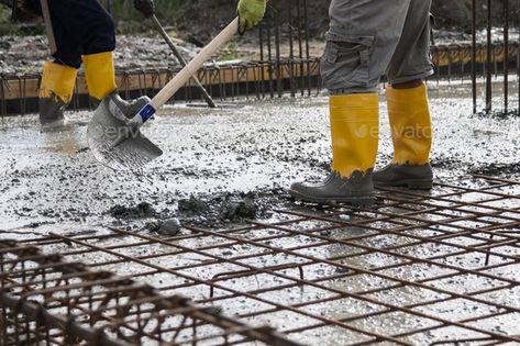 two bricklayers who level the freshly poured concrete to lay the foundations of a building by EmanueleRaveccaPhotographer. two bricklayers at work on a construction site during the laying of concrete to build the foundations of a house #AD #concrete, #lay, #foundations, #poured Poured Concrete, Brickwork, Construction Site, A House, Cement, Foundation, Home Improvement, Building, Boots