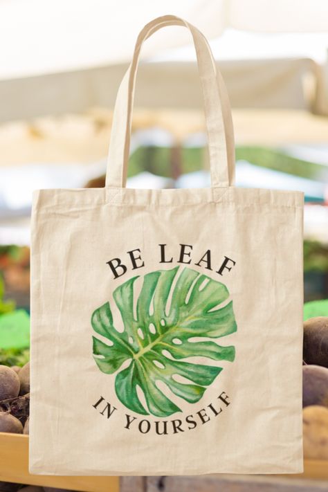 Be Leaf in Yourself! Funny and cute plant pun. Perfect design for all plant parents, indoor gardeners, balcony gardeners, farmers, and those with or without a green thumb. The reusable tote bag is perfect for anyone looking be more sustainable. This design is also available on a sticker, magnet, mug, cup, poster, or shirt. Tap the photo to see all. No matter your current life endeavor, remember to always be leaf in yourself! Great gift for your favorite plant lover. @RachelJoyP RebBubble Diy Gifts For Gardeners, Be Leaf In Yourself, Daisy Clothing, Planting Party, Tote Bag Outfit, Be More Sustainable, Gift For Plant Lover, Plant Puns, Plant Bags